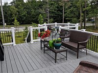 <b>Trex Transcend Pebble Gray Decking with White Washington Vinyl Railing and Black Aluminum Balusters in Brandywine MD</b>